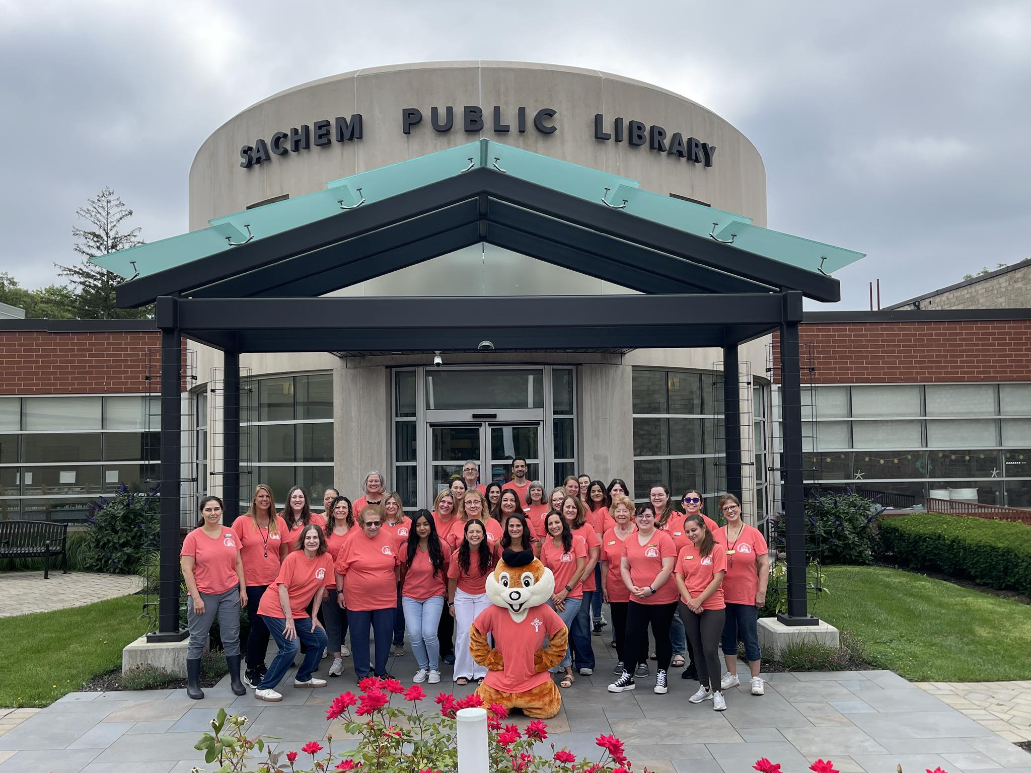 Staff in front of the Sachem Public Library