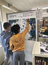 Photo of students working on magnetic puzzle